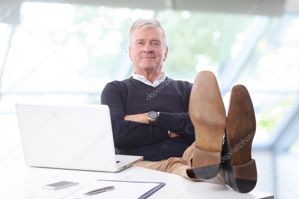businessman  sitting  leaning back