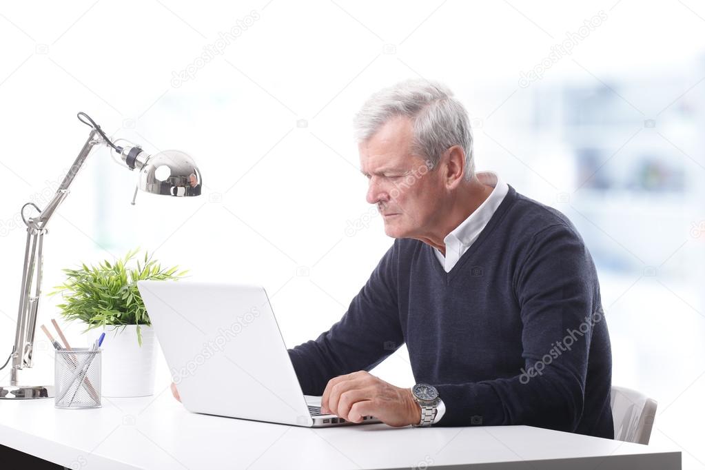 businessman sitting  in front of laptop