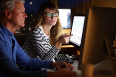 director and  businesswoman analyzing  data