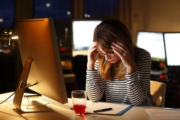 businesswoman sitting at office desk