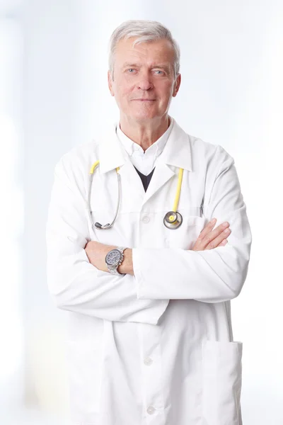 Executive senior doctor standing — Stok fotoğraf