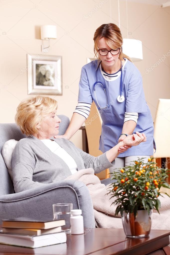 Senior woman with home caregiver 