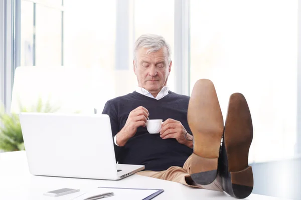 Confident sales man sitting — Stok fotoğraf