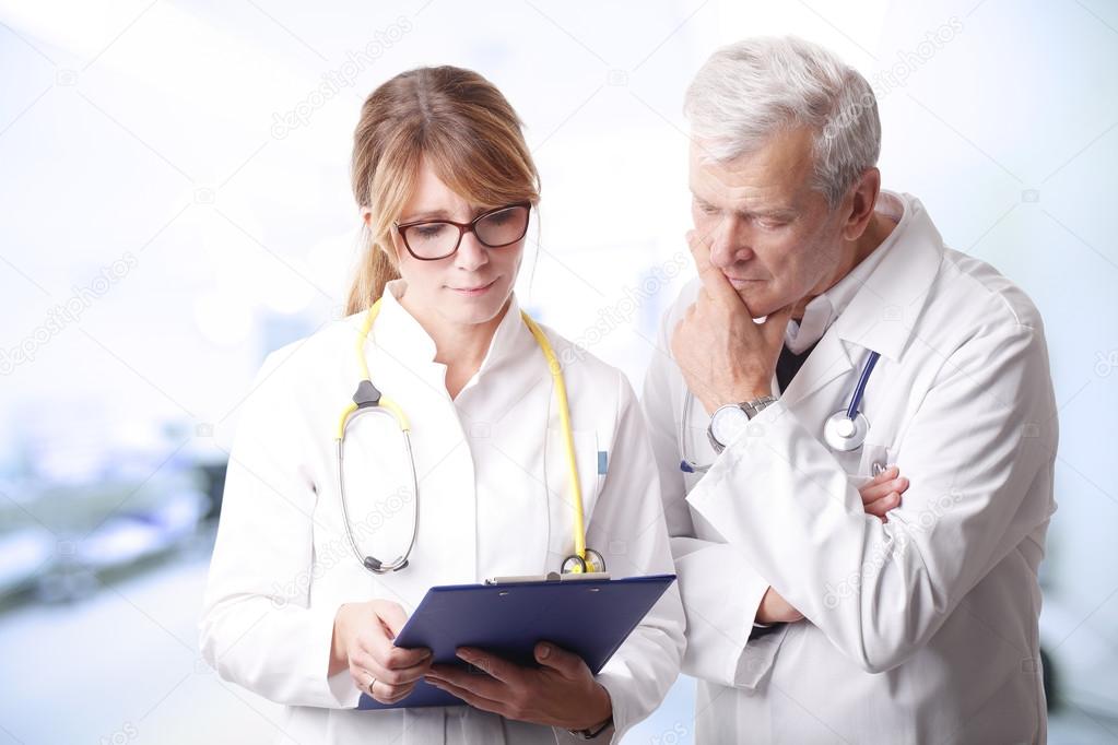 female doctor holding  a clipboard