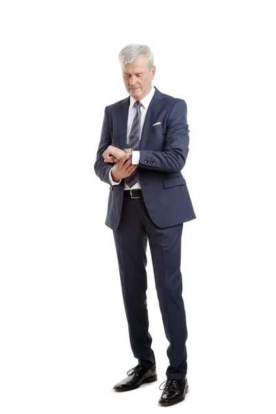 Senior businessman checking time. — Stock Photo, Image