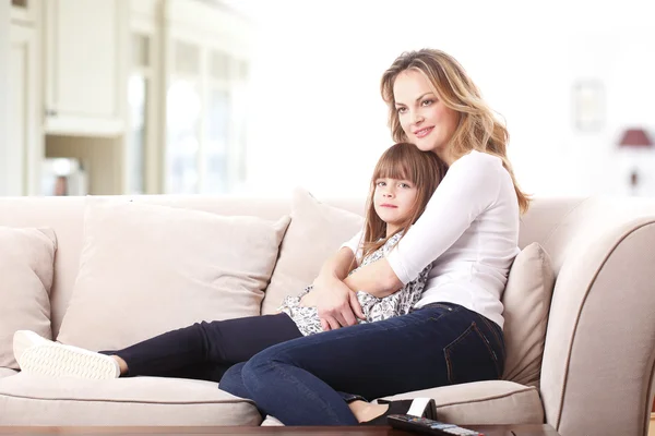 Mother embracing her cute daughter — Stockfoto