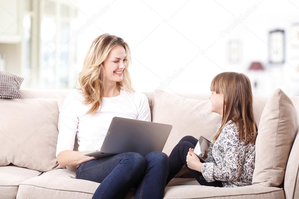 mother working online with laptop