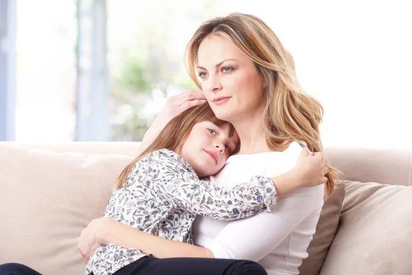 Affectionate mother huging her daughter — Stock Photo, Image