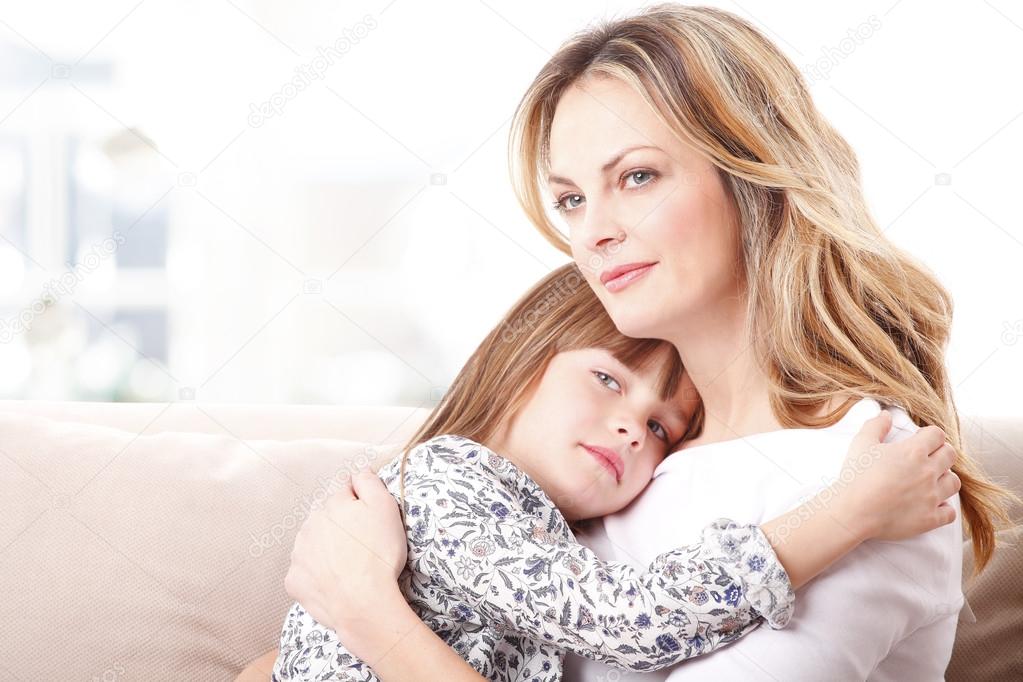 mother huging her daughter