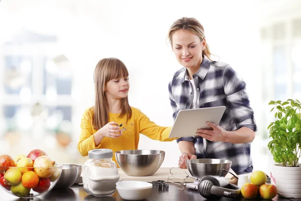 Mother reading recipe