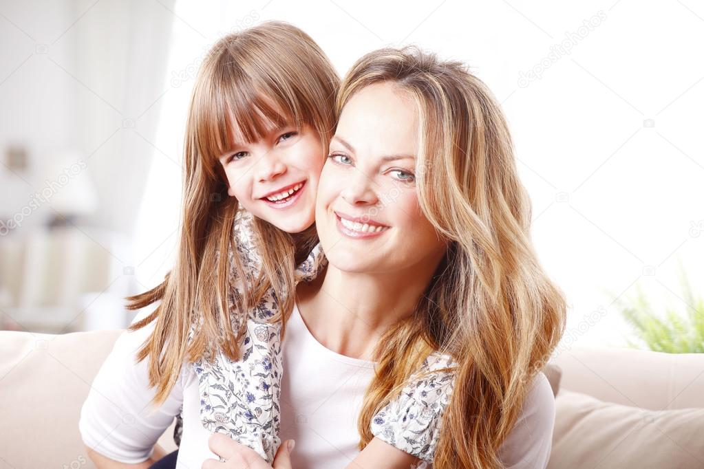 girl huging her mother