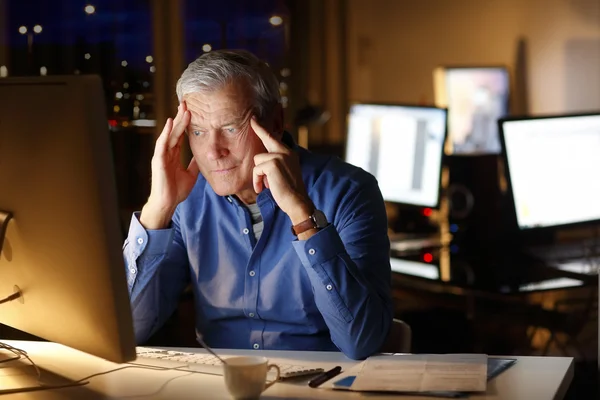 Businessman working late — Stock Photo, Image