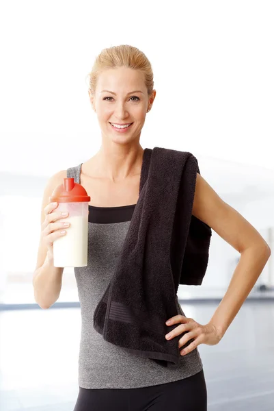 woman holding a protein shaker