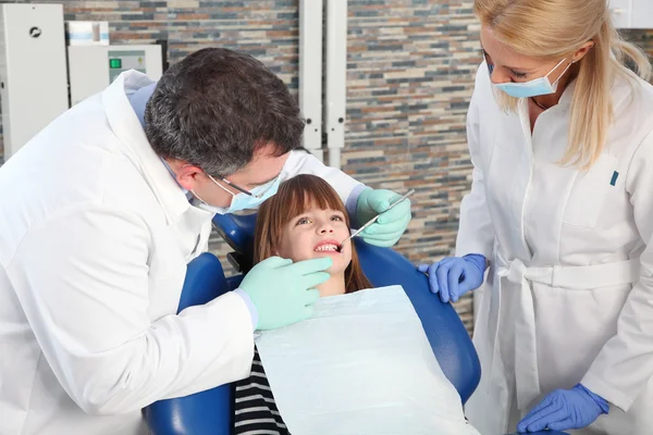 Dentist and  assistant with  patient — Stock Photo, Image