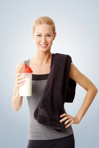 Woman holding a protein shaker — Stock Photo, Image