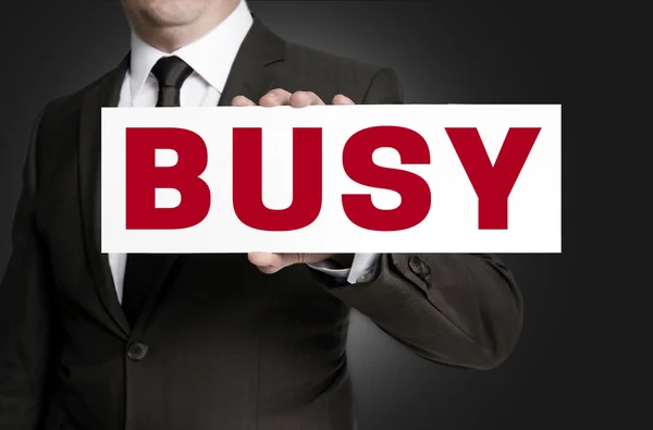 Busy sign is held by businessman background — Stock Photo, Image