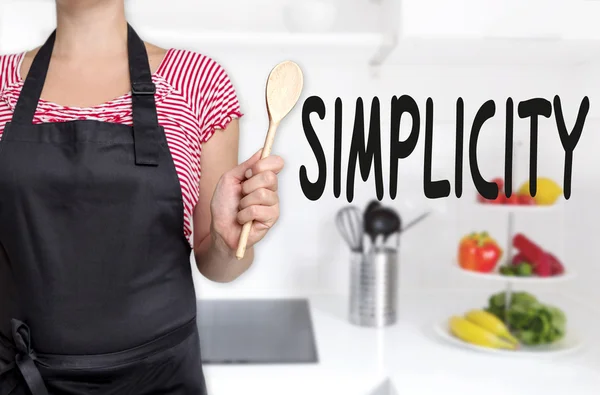 Simplicity cook holding wooden spoon concept background — Stock Photo, Image