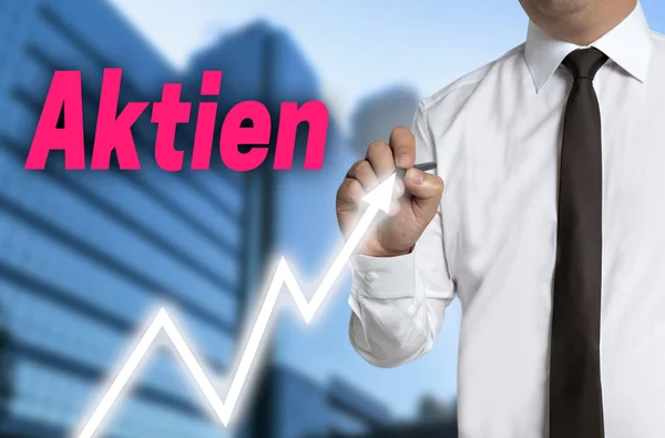 Aktien (in german shares) trader draws market price on touchscre — Stock Photo, Image