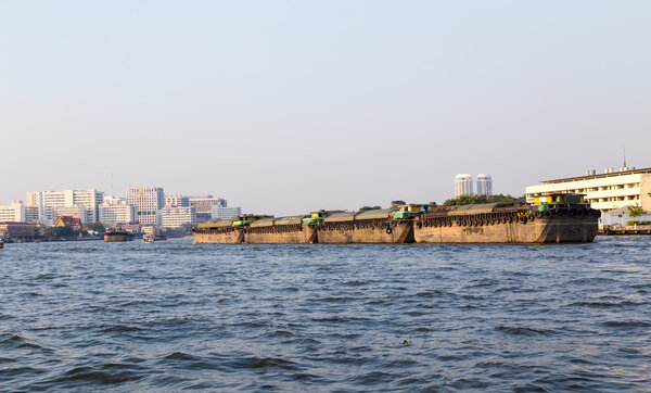Chao Phraya river in Bangkok with cargo ship