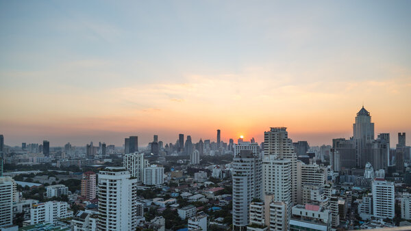 Bangkok skyline at sunset panorama.