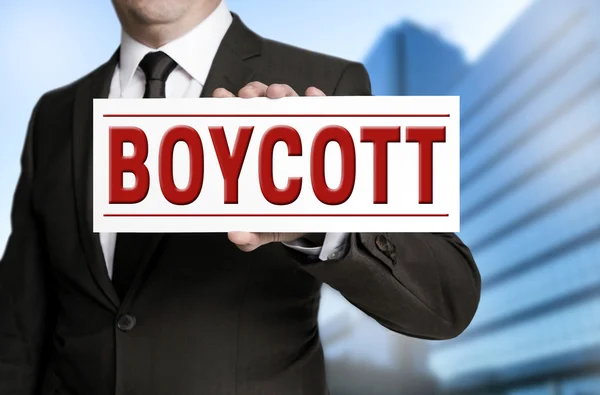 Boycott shield is held by businessman — Stock Photo, Image