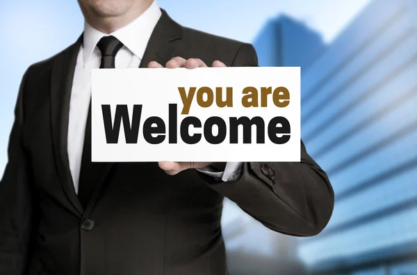 You are welcome sign is held by businessman — Stock Photo, Image