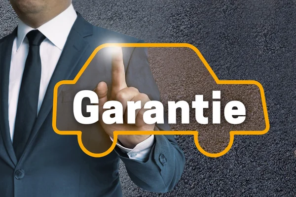 Garantie (in german warranty) auto touchscreen is operated by bu — Stock Photo, Image