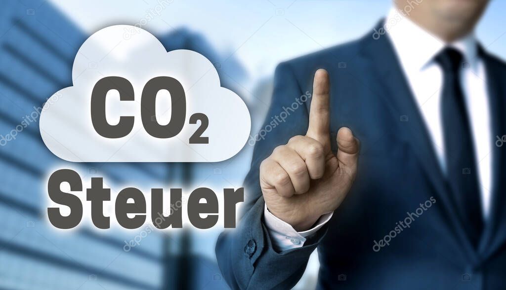 CO2 Steuer (in german carbon tax) concept is shown by businessman.