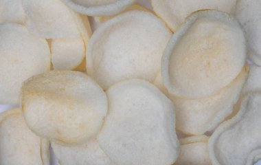 Crabbread chips on a white surface.
