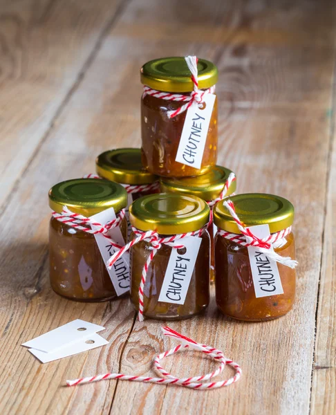 Onion pineapple chutney on rustic wood — Stock Photo, Image