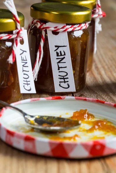 Onion pineapple chutney on rustic wood — Stock Photo, Image