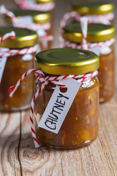 Onion pineapple chutney on rustic wood — Stock Photo, Image