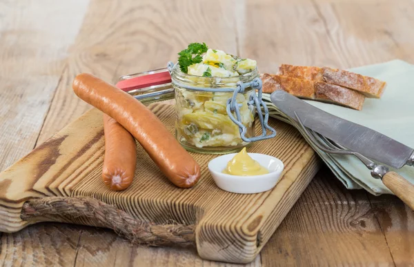 Sausages with mustard and potato salad — Stock Photo, Image