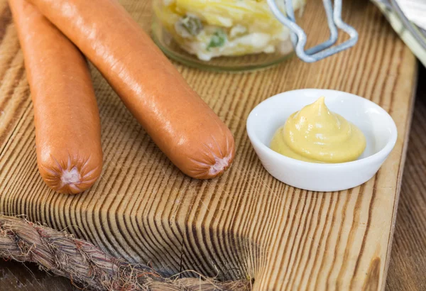 Sausages with mustard and potato salad — Stock Photo, Image
