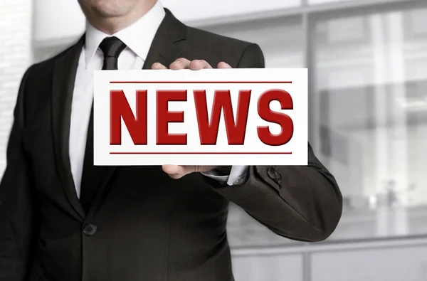 Businessman holding News sign to Viewer — Stock Photo, Image