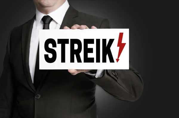 Strike sign is held by businessman — Stock Photo, Image