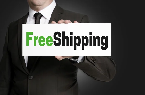 Free shipping sign is held by businessman — Stock Photo, Image