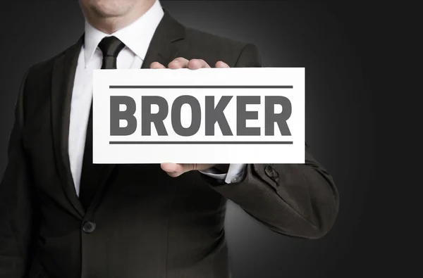 Broker sign is held by businessman — Stock Photo, Image