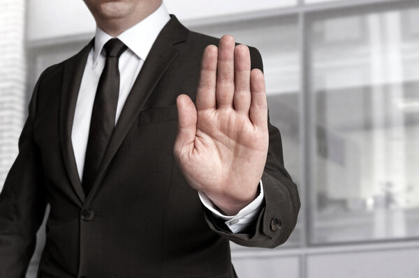 Hand stop shown by businessman
