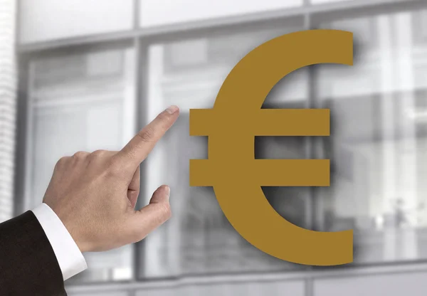 Hand pointing at Euro sign concept — Stock Photo, Image