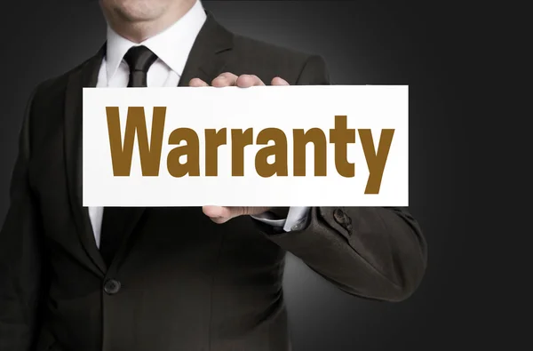 Warranty sign is held by businessman — Stock Photo, Image