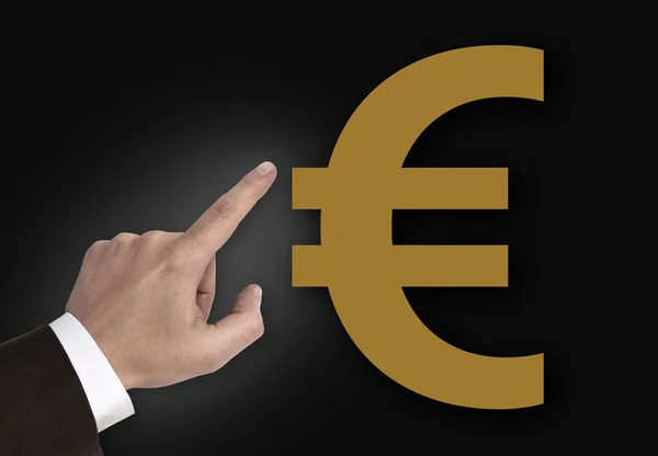 Mano apuntando al concepto de Euro signo — Foto de Stock