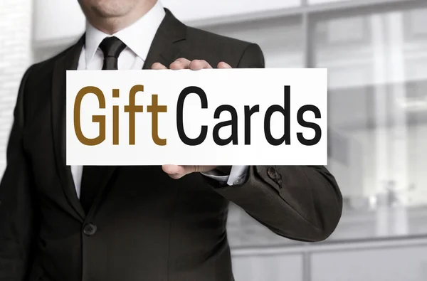 Gift Cards sign is held by businessman — Stock Photo, Image