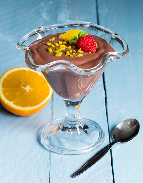 Chocolate pudding dessert with orange and pistachio — Stock Photo, Image