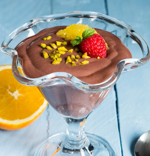Chocolate pudding dessert with orange and pistachio — Stock Photo, Image