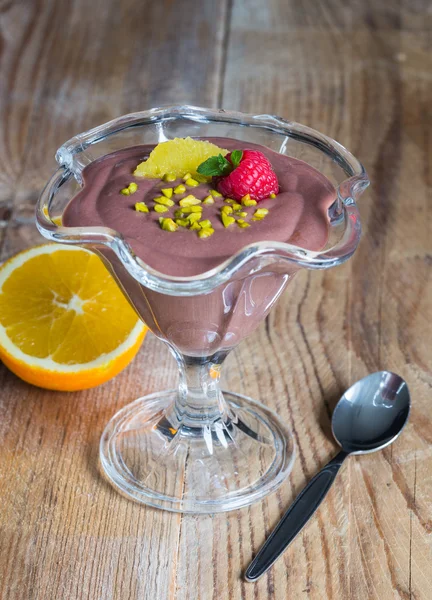 Chocolate pudding dessert with orange and pistachio — Stock Photo, Image