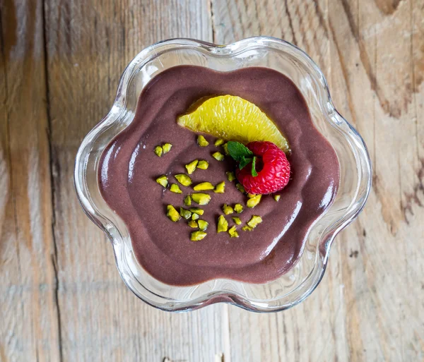 Chocolate pudding dessert with orange and pistachio — Stock Photo, Image