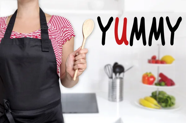 Yummy chef holding wooden spoon background — 스톡 사진