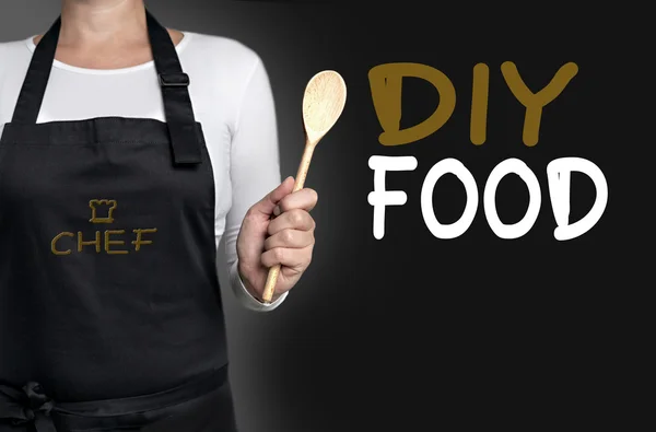 Diy food cook holding wooden spoon background — Stock Photo, Image