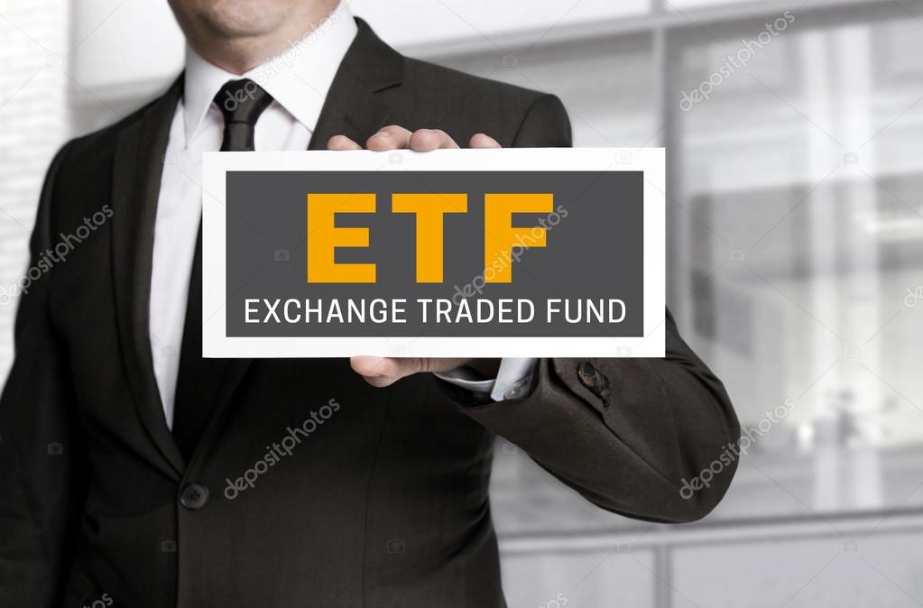 ETF sign is held by businessman background